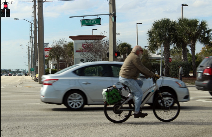 Man on Bike on Military Trail and Okeechobee in West Palm Beach, FL