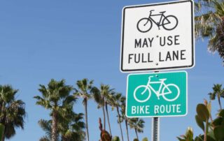 Bike Lane Sign in South Florida where bikes ride along with uninsured motorists.